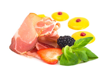 Slices of Italian prosciutto isolated. Spanish jamon cut, parma ham, serrano or iberico on white background closeup