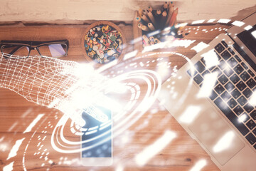 Double exposure of technology theme drawing over work table desktop. Top view. Global data analysis concept.