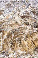Close-up of turbulent river water, torrent rapids.