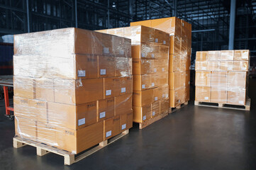 Stacked of Package Boxes Wrapped Plastic Flim on Wooden Pallet at Storage Warehouse. Shipment Boxes. Cargo Export- Import.