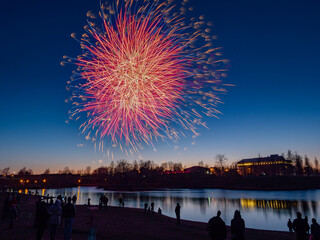 Fototapeta na wymiar Festive fireworks in honor of Victory Day, May 9 in Petrozavodsk, Republic of Karelia (northwest of Russia)