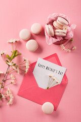 Festive holiday greeting card for Mothers Day. Rose macaroons in gift box and Cherry blossoms.