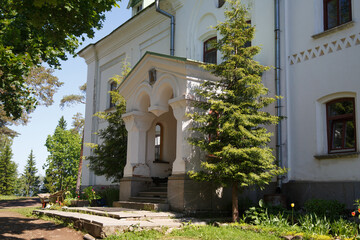 Ancient white building in a shady park, Valaam island, Russia.