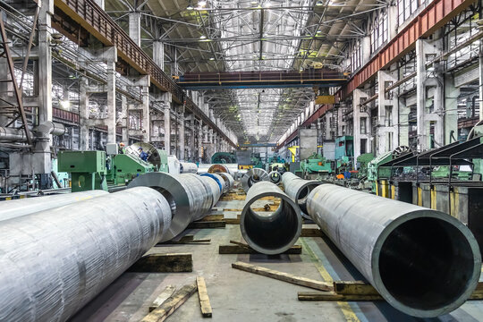 Pipe factory production line warehouse interior, metalwork heavy industry.