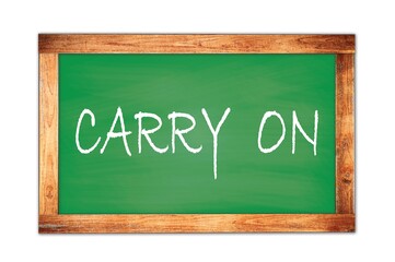 Fototapeta premium CARRY ON text written on green school board.