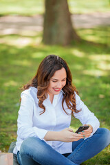 Young happy woman texting in the messenger. Quarantine.