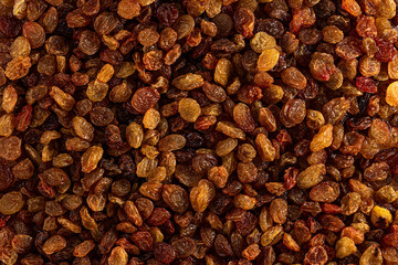 Raisins are beautifully dried highest grade. Delicious background or wallpaper. Grape Raisins as an abstract background texture