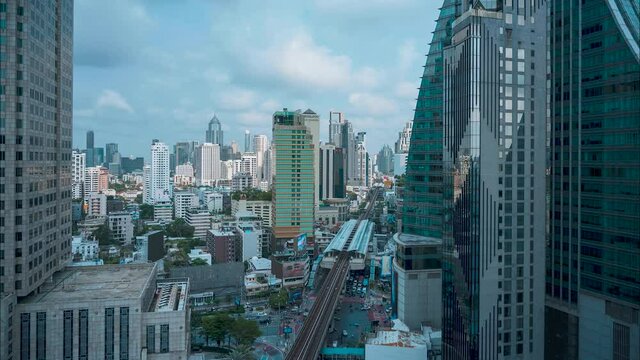 Asoke Bangkok traffic Downtown timelapse with White Clouds