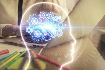 Multi exposure of woman hands working on computer and human brain hologram drawing. Ai tech concept.
