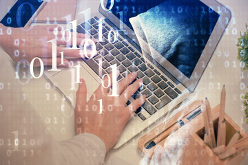 Double exposure of woman hands working on computer and data theme hologram drawing. Tech concept.