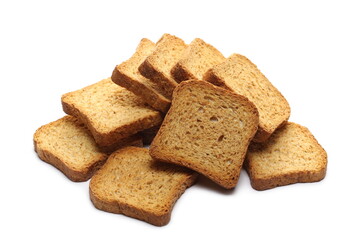 Wholemeal crackers, bread rusks pile, toast slices isolated on white background