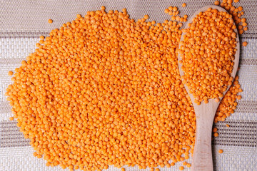 orange lentils in wooden bowl. Healthy lifestyle. Vegetarian and vegan diet.