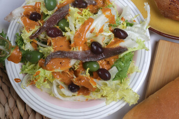 spanish salad with anchovies lettuce cod an special sauce