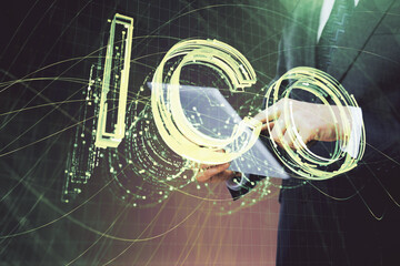 Double exposure of man's hands holding and using a phone and crypto currency blockchain theme drawing.