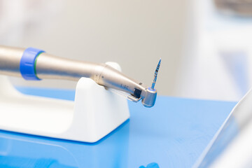 a mechanical instrument for implantation lies on the table in dentistry.