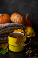 Hot tea cup with autumn decorations, Thanksgiving, autumn background