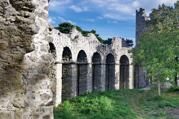 Fototapeta na wymiar Stone Ruins of the old amphitheater in the landscape park around Lichtenstein Castle with beautiful blue sky and nature. Visit Austria, trip to the Vienna forest.