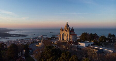 Aerial sunrise panorama of Santuario de Santa Luzia monastery sanctuary hilltop church in Viana do...