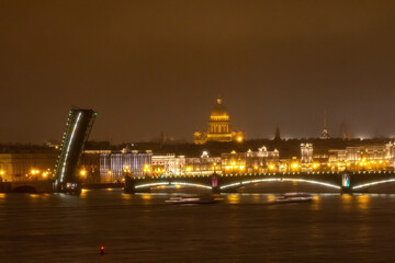Fototapeta na wymiar View of the embankment of the city of St. Petersburg at night with drawbridges