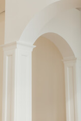 minimalistic architecture concept real white classic columns and arch greek style wall inside, wood panels columns