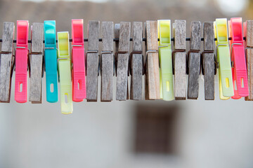 Wire clothesline for drying clothes outdoors with tongs