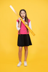 surprised teen girl study math with ruler measuring size, back to school