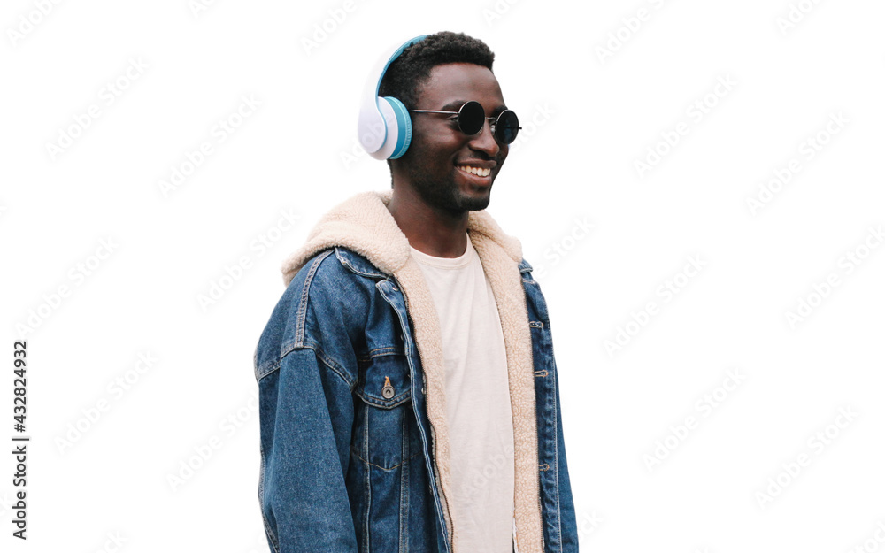 Wall mural Portrait close up of happy smiling african man in wireless headphones listening to music isolated on a white background