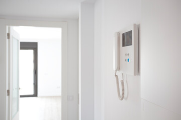 Barcelona, Spain. 9-25-2019. An Intercom in the entrance hall of a bright brand new apartment sold by a real estate agency.