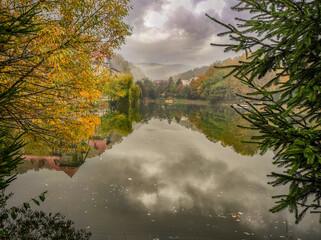 Beautiful view of the lake in cloudy weather in the village of Polyana, Zakrapat region