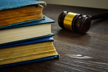 Law and justice concept. Stack of book and gavel.