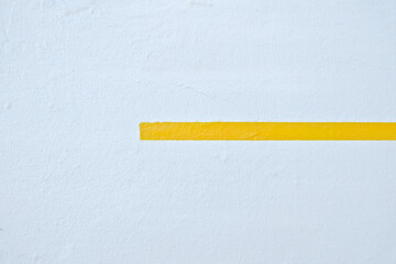 A thick yellow line on a white background.