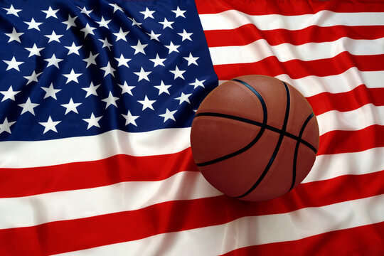 BASKETBALL BALL ON THE AMERICAN FLAG. USA BASKETBALL SUCCESS.