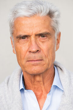 Headshot Of Handsome Older Man With Serious Expression