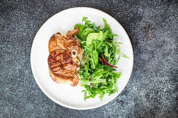 meat grill bbq hot steak fresh salad beef on the bone lamb or beef snack trend meal copy space food background rustic. top view