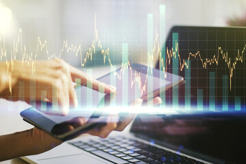 Abstract creative financial graph with finger clicks on a digital tablet on background, forex and investment concept. Multiexposure