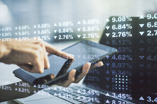 Multi exposure of creative statistics data hologram with finger presses on a digital tablet on background, stats and analytics concept