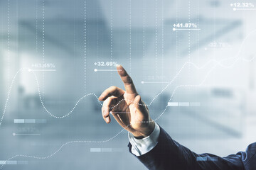 Man hand working with abstract virtual stats data hologram on blurred office background. Multiexposure