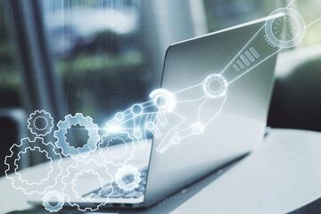 Fototapeta premium Double exposure of robotics technology hologram on laptop background. Research and development software concept