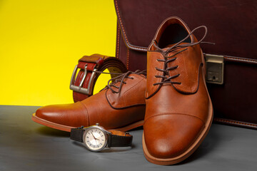Collection of men's accessories. Men's shoes, belt, watch and briefcase. Mens accessories background.
