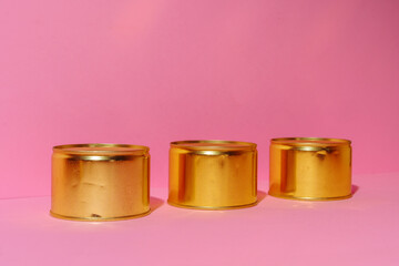 Canned food tin on pink studio background