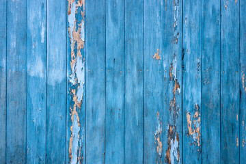 Old blue wood wall background weathered rain till decay.