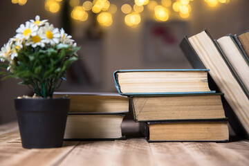 stack of books and flower