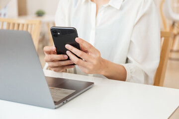 woman work using texting cell phone typing computer.student study education online learning.adult professional chatting on laptop,mobile contact us at Thinking business plan.connecting people concept