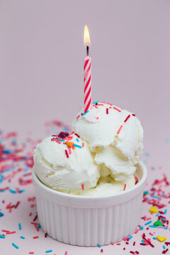 Vanilla ice cream and candle