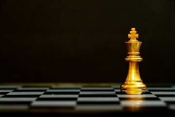 Gold king chess piece stand on black background with copy space (Concept for leadership, unique)
