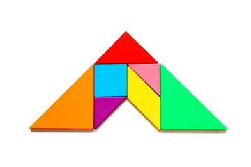 Color tangram puzzle in arrow shape on white background