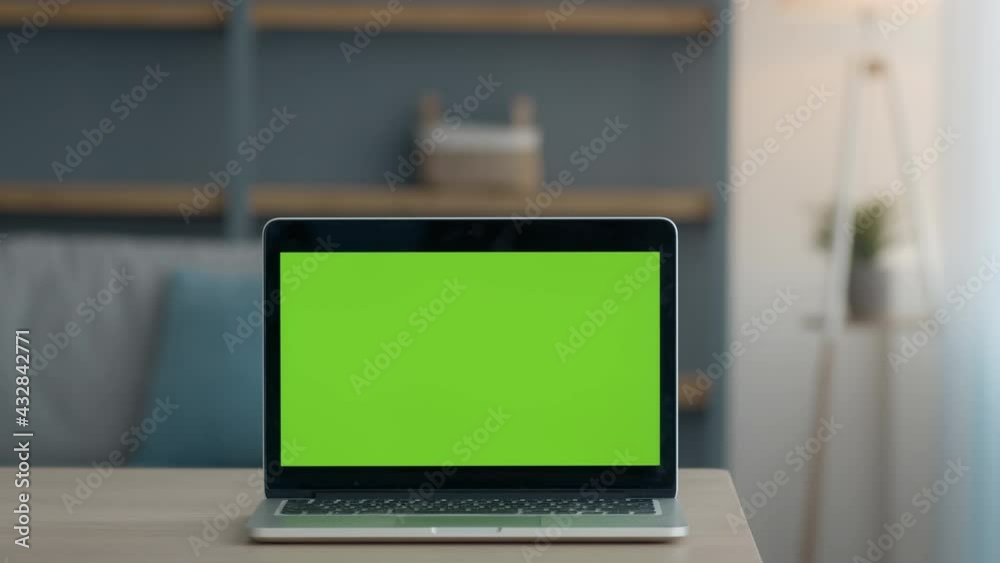 Poster zoom in shot of modern laptop with green chroma key screen, mockup for text, application or website