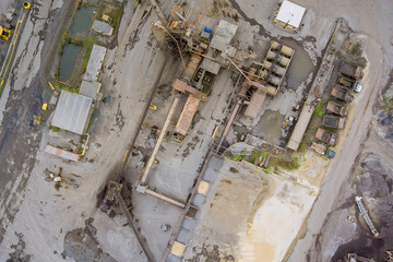 Panorama aerial view open pit mine mining, dumpers, quarrying extractive industry stripping work big mining trucks of machinery trucks.