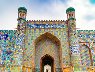 The portal of The Palace of Khudayar Khan, known as the Pearl of Kokand, with description on facade...