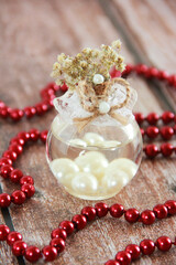 decorative glass perfume bottle and red beads